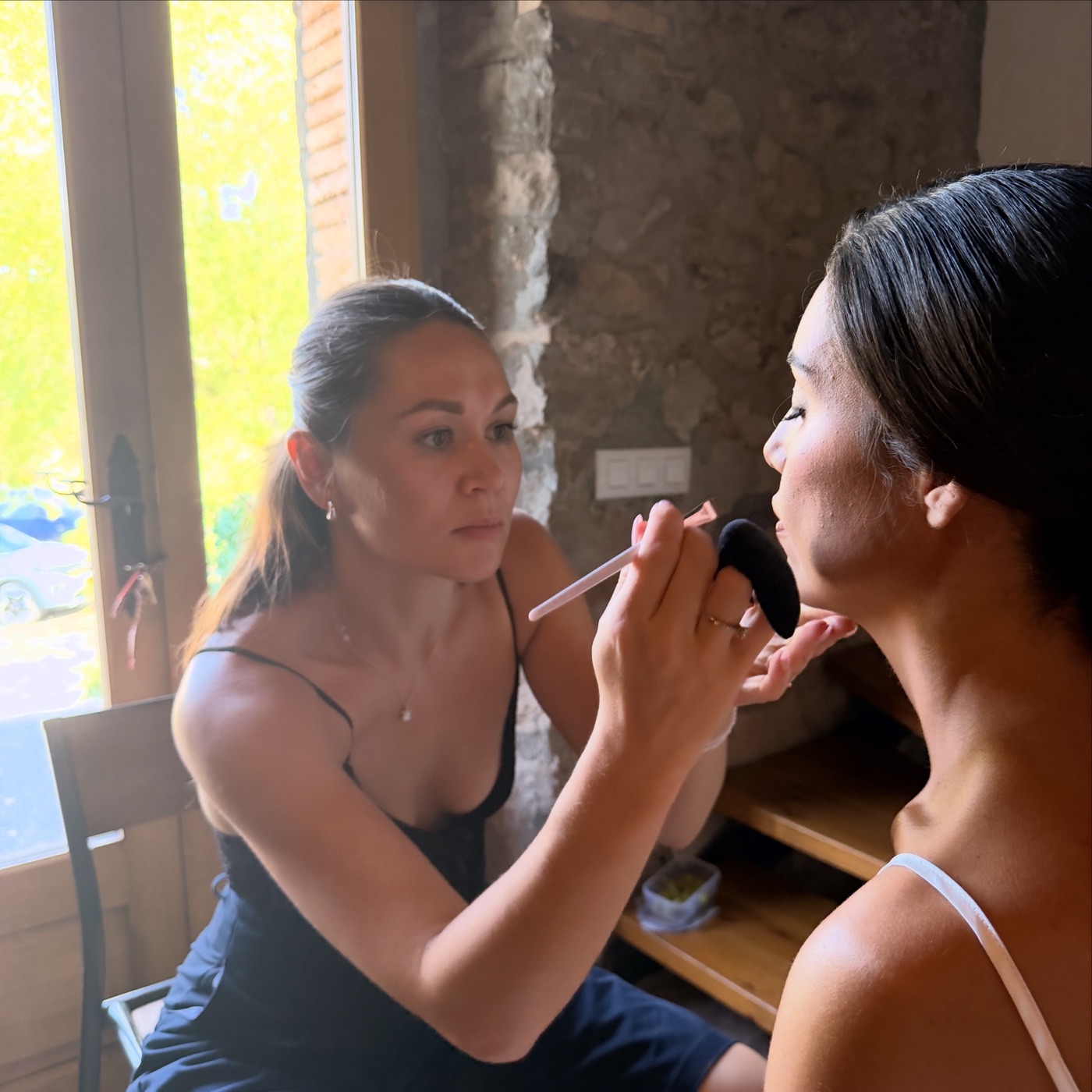 Oksana applying bridal makeup