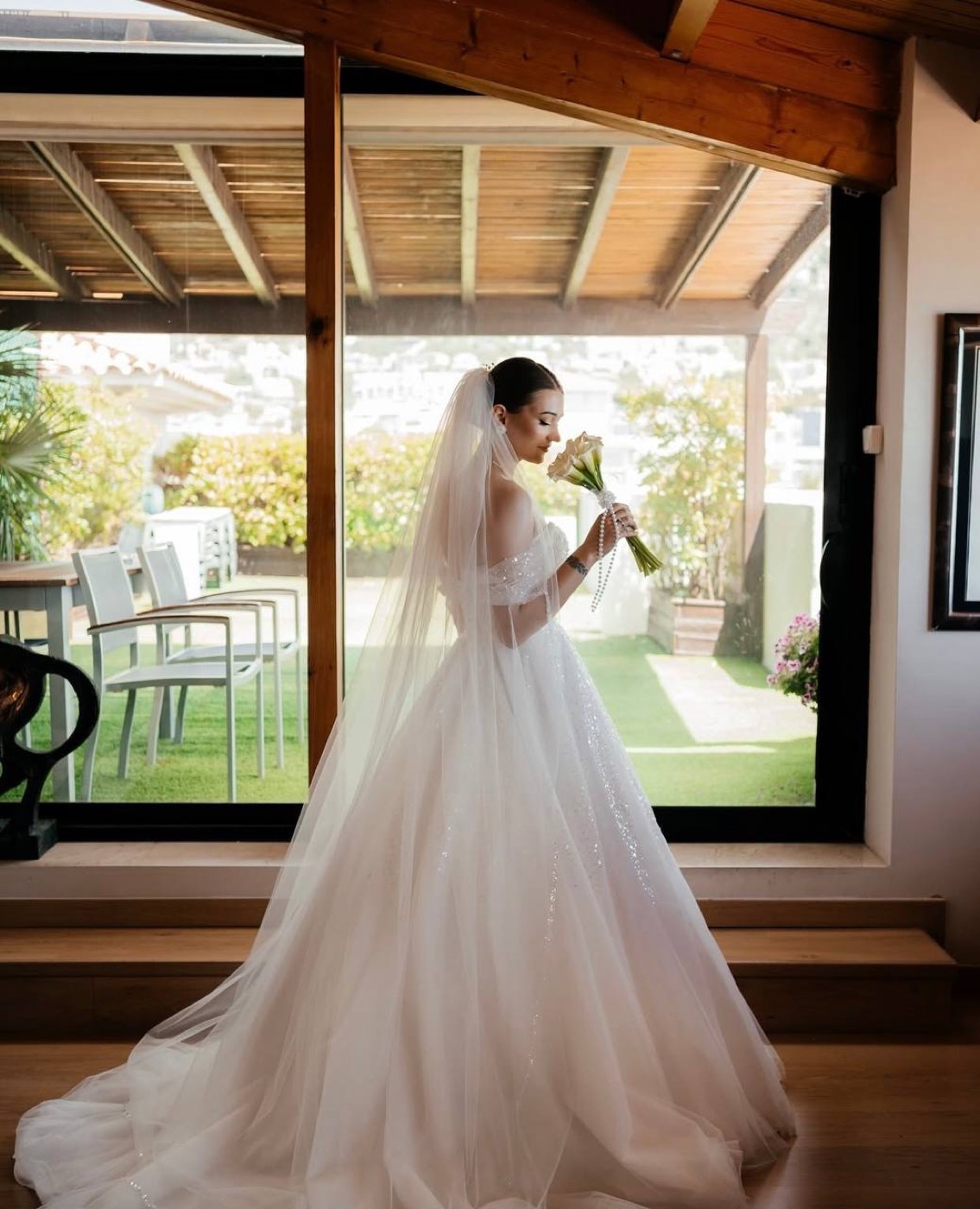 Bride with veil by the window